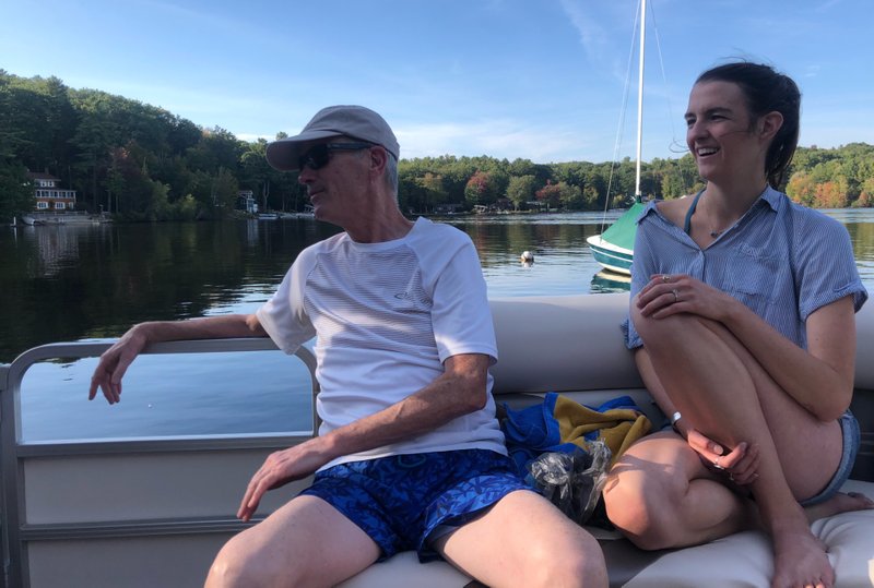 My dad and me, enjoying a blue-bird day on a New Hampshire lake with my mom’s brothers.