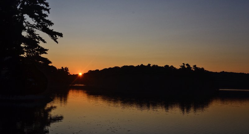 Sun over the lake in Canada. My mom always made sure to catch the sunrise and sunset, so we did too.